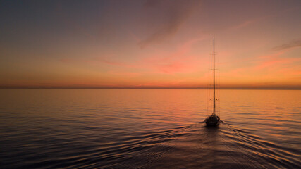 Superyacht sailing boat sunset over the sea 2