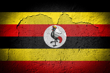 Uganda flag on cracked wall