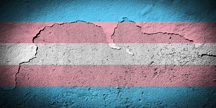 Transgender pride flag on cracked wall