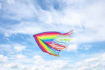 fly to left kite on blue sky with white clouds