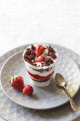 Strawberry trifle dessert in grey dish on the table