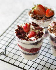 Strawberry trifle dessert on the black lattice.