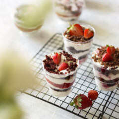 Strawberry trifle dessert on the black lattice.
