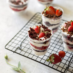 Strawberry trifle dessert on the black lattice.
