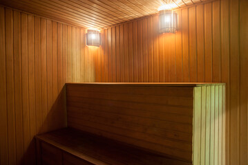 The interior of the sauna. Dim warm lighting