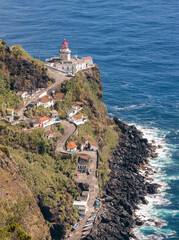 Fototapeta na wymiar Lighthouse Arnel on a promontory in Sao Miguel, Azores Islands