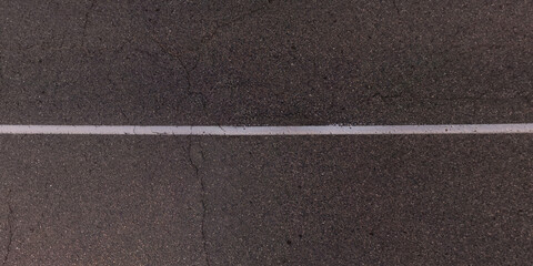 Fototapeta premium top view from above on texture of old asphalt road