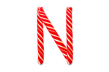 Obraz premium Christmas Candy Cane in the form of letter N. Letter N made of Red Candy Cane Isolated on White Background
