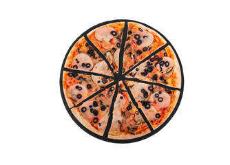 Sliced pizza with ham, mozzarella, mushrooms and olives on a black slate platter, isolated on white background, top view