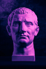 Statue of Guy Julius Caesar Octavian Augustus. Creative concept colorful neon image with ancient...