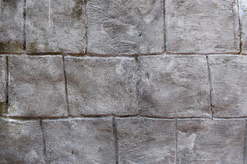 Rough gray Cement large brick design wall texture for background.