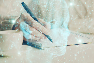 Multi exposure of writing hand on background with brain hologram. Concept of learning.