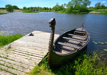 An old viking longboat docked 