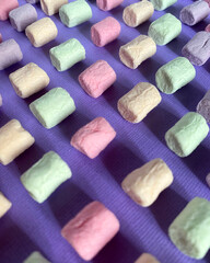 Marshmello on a surface of different colors