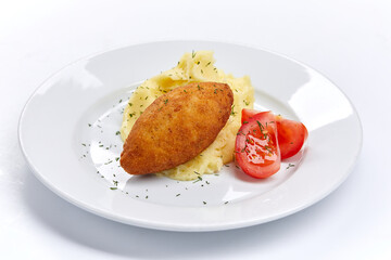 cutlet with mashed potato and tomato