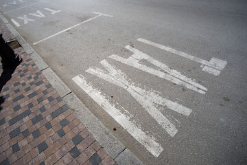 "Taxi" lane painted on a street