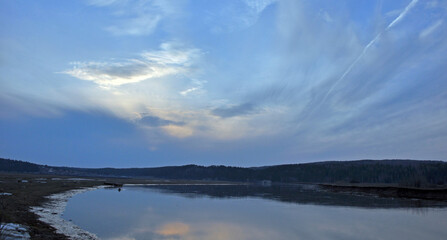 The river Sylva after ice drift and spring flooding enters its banks. Spring in the foothills of the Western Urals.