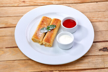 pancakes with sour cream and berry sauce