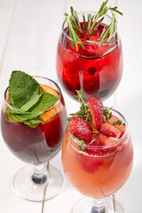 summer cocktail with fresh berries and fruits