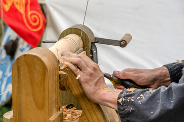 Carpinter working on a foot powered lathe