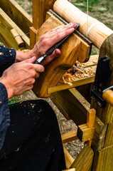 Carpinter working on a foot powered lathe