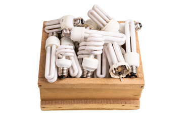 Old Fluorescent Light Bulbs Isolated on white. Energy saving lamp in wooden box