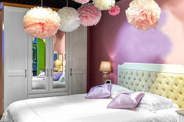 Cozy bridal bedroom interior decorated with paper pumps. Pink bedroom interior