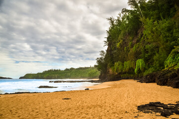 Deserted and heavenly yellow sand beach. Secret beach in Hawaii