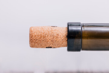 Cork in a bottle of wine close up with copy space for text. Template for greetings.