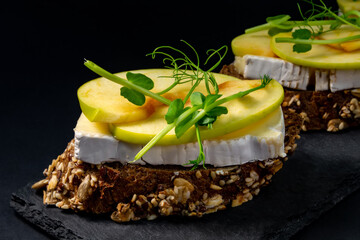 fresh bruschetta with shrimp, cheese, ham and microgreens