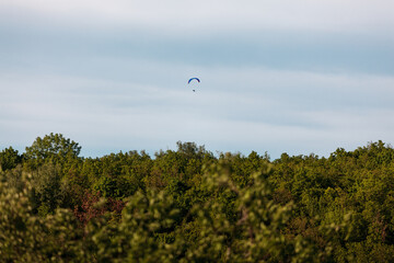 paragliding in the blue sky