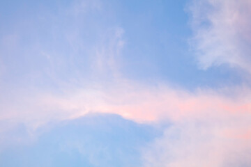 Naklejka na ściany i meble Blue sky with pink clouds. The sky in the morning. Beautiful background for text.