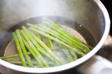 Asparagus blanched in a pan with boiling water