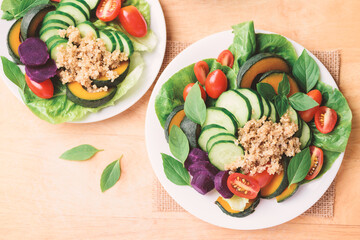 Salad quinoa with vegetables on plate, Vegan food