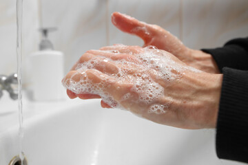 Hand washing with soap and water to prevent coronavirus and hygiene to stop the spread of coronavirus. Hand washing.