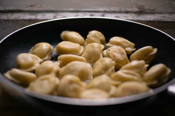 frying pan with dumplings