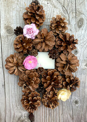 stylish wooden background with pine cones, copy space for text. seasonal holidays and SPA concept