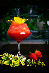 red, berry, alcoholic cocktail in a glass goblet on a short leg