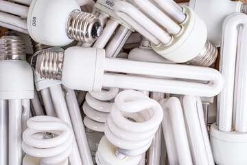 A mixture of discarded Neon light bulbs to be recycled fills a box
