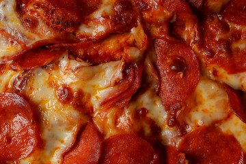 Pizza. spicy pizza on a cardboard box. Tasty pizza with bacon, salami and cheese.Background pizza pepperoni.