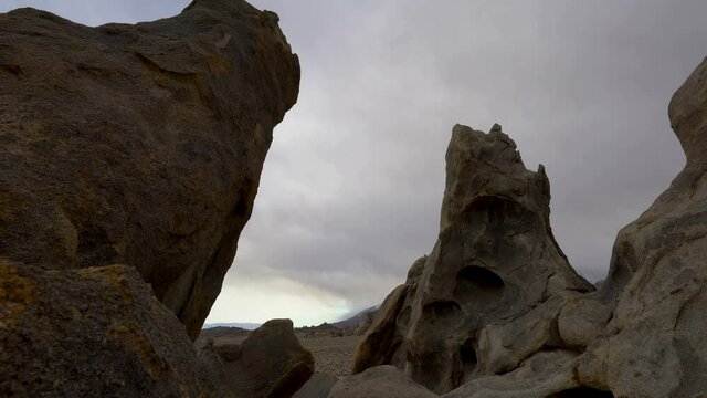 Tracking shot of towering volcanic boulder at Alabama Hills, California
