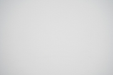 White concrete surface with small pits. Background cement