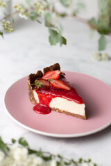 Classic New York Cheesecake. Delicious cheesecake with strawberries on table close up