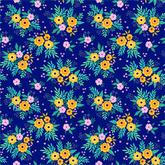 Simple cute pattern in small yellow flowers on dark blue background. Liberty style. Ditsy print. Floral seamless background. The elegant the template for fashion prints.