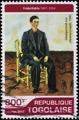 Self-portrait by Frida Kahlo dressed as a man on stamp