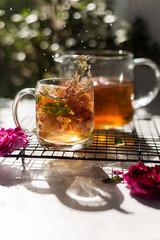Tea made from tea rose in a glass cup.