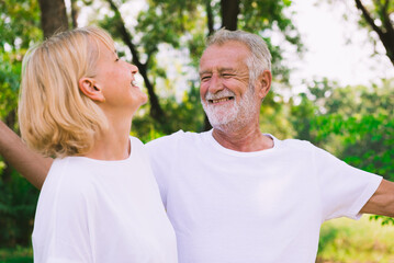 Old couple relax together in the park