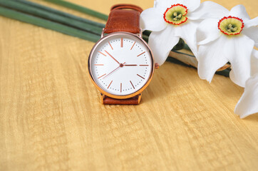 Watch with white flowers. Stock photography, a place for a label
