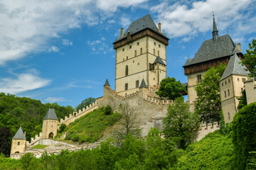 Fototapeta na wymiar Overall look on historic Karlstejn castle in Karlstejn village, Czech Republic