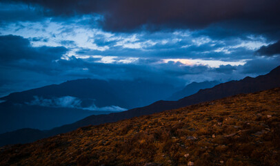 Hills and dark cloud covering during an evening in the mountains. Scene from Lauribinayak on the Gosainkunda lake trail in Langtang region of Nepal. 